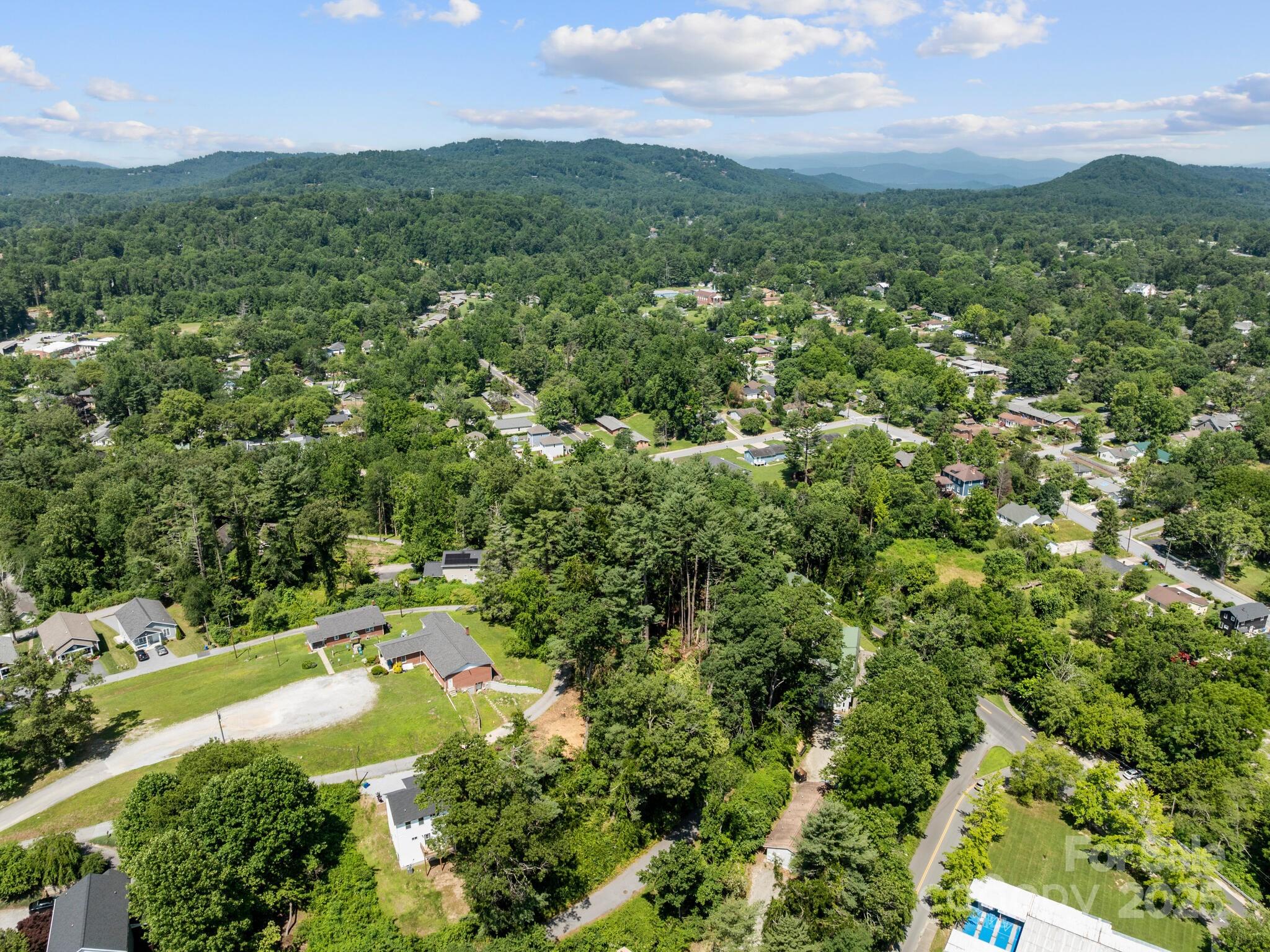 0 Summit Circle, Unit 17 Hendersonville, NC 28739 - Photo 15 of 22 a view of a city with lush green forest
