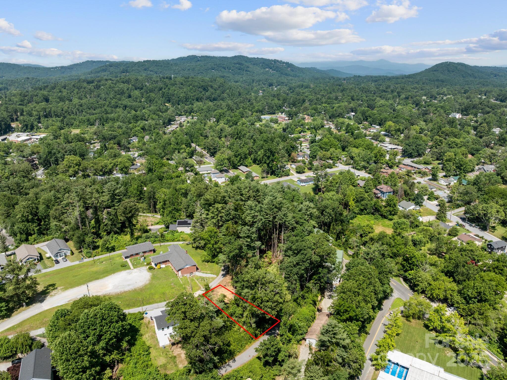 0 Summit Circle, Unit 17 Hendersonville, NC 28739 - Photo 18 of 22 a view of a city with lush green forest