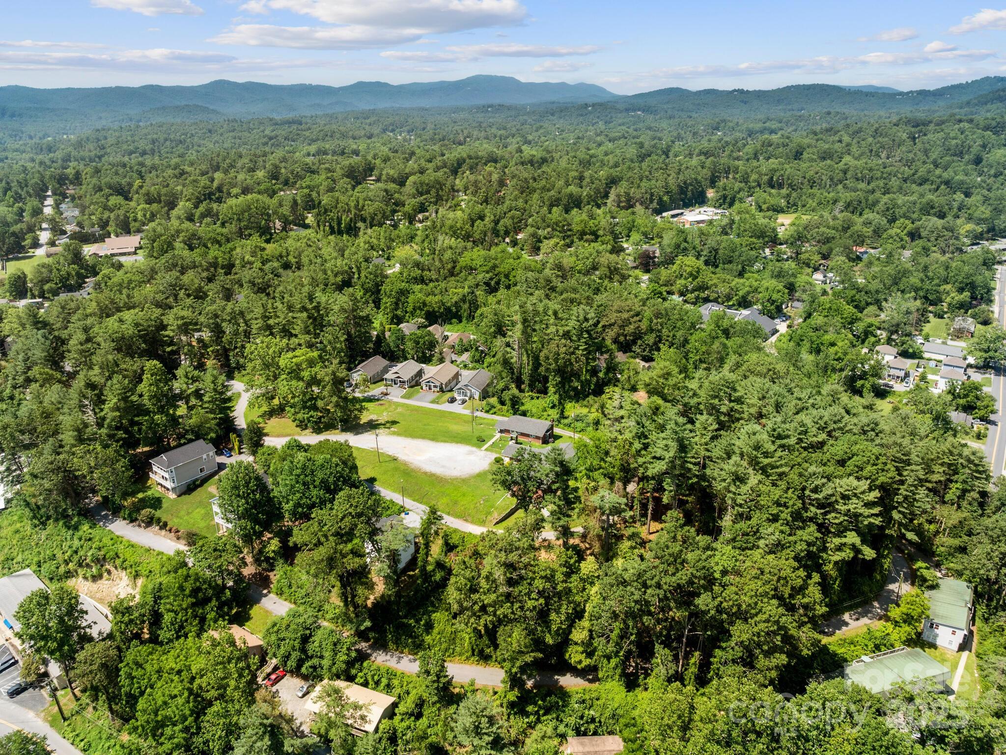 0 Summit Circle, Unit 17 Hendersonville, NC 28739 - Photo 19 of 22 a view of a lake with a yard
