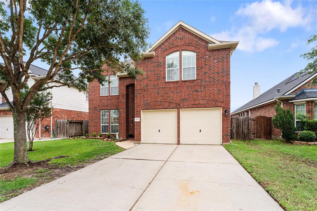 Approaching the stately brick home, you immediately notice the mature hardwood tree, tidy landscaping, 2-car garage, and a long double-wide driveway.