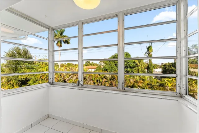 a view of a multi story window with an outdoor space