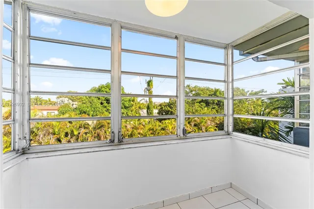 a view of a room with a large window