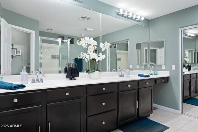 a bedroom with a bed and a table with chair