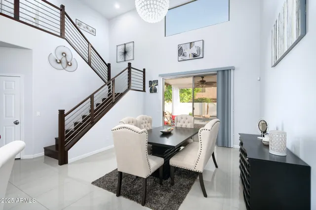 a kitchen with stainless steel appliances kitchen island granite countertop a refrigerator and a stove