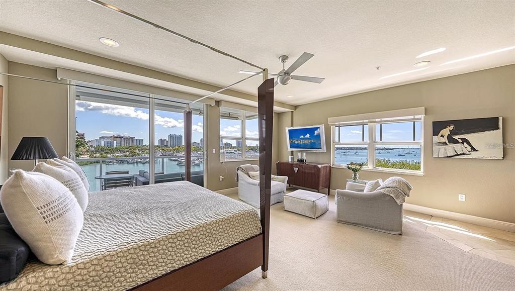 650 Golden Gate Point, Unit 602 Sarasota, FL 34236 - Photo 22 of 50 a living room with furniture and a floor to ceiling window