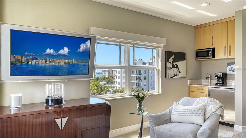 650 Golden Gate Point, Unit 602 Sarasota, FL 34236 - Photo 24 of 50 a living room with furniture and a large window