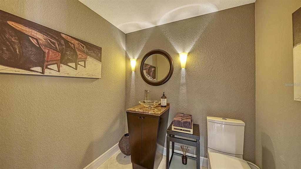650 Golden Gate Point, Unit 602 Sarasota, FL 34236 - Photo 31 of 50 a table with chairs and wooden floor