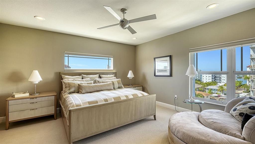 650 Golden Gate Point, Unit 602 Sarasota, FL 34236 - Photo 35 of 50 a bedroom with a bed couch and window