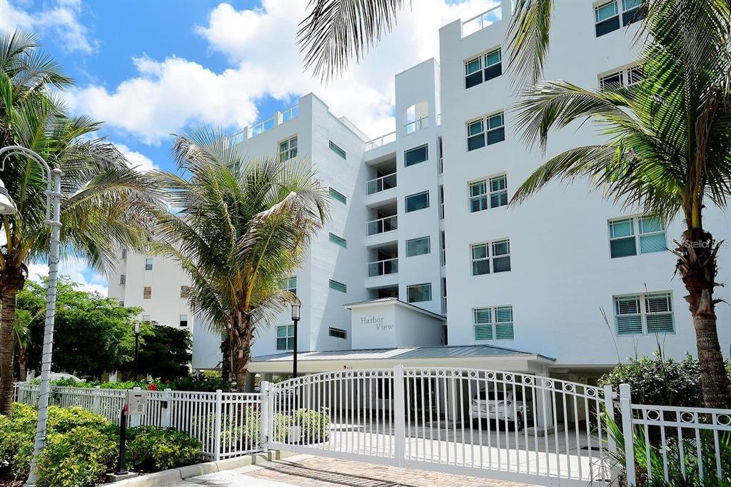 650 Golden Gate Point, Unit 602 Sarasota, FL 34236 - Photo 50 of 50 a view of a tall building with a palm trees