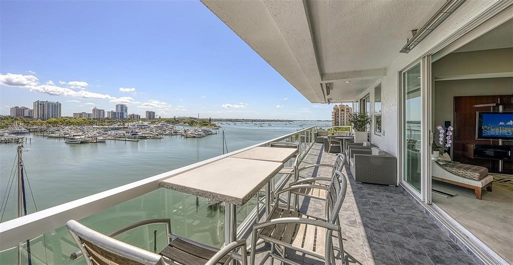 650 Golden Gate Point, Unit 602 Sarasota, FL 34236 - Photo 5 of 50 a view of a lake from a balcony
