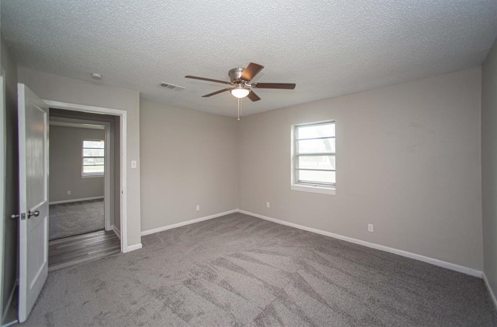 317 Pear Street La Marque, TX 77568 - Photo 11 of 18 a view of a room with a ceiling fan and a window