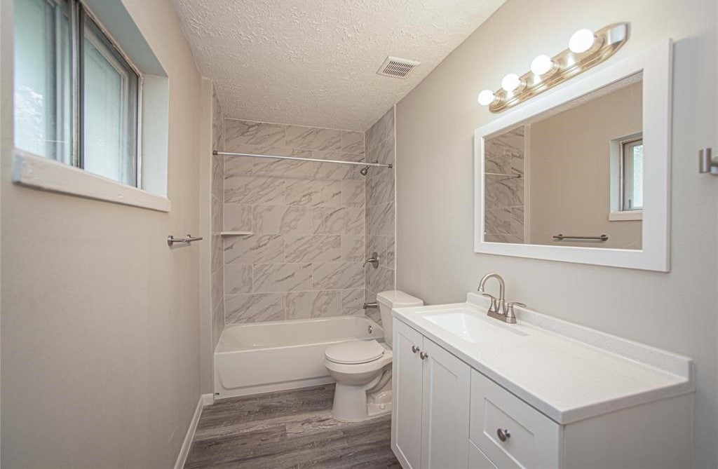 317 Pear Street La Marque, TX 77568 - Photo 15 of 18 a bathroom with a sink a toilet and shower