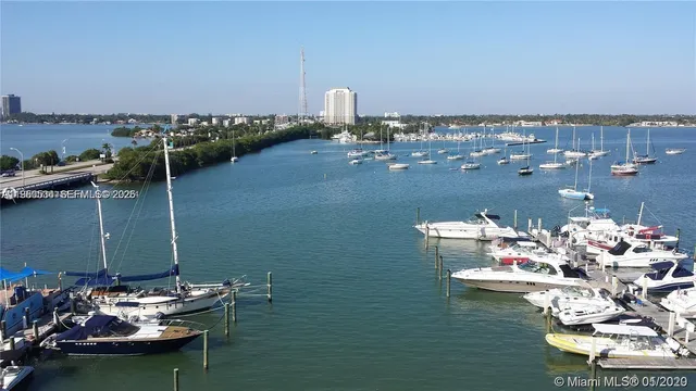 a table with chairs and has more things on it