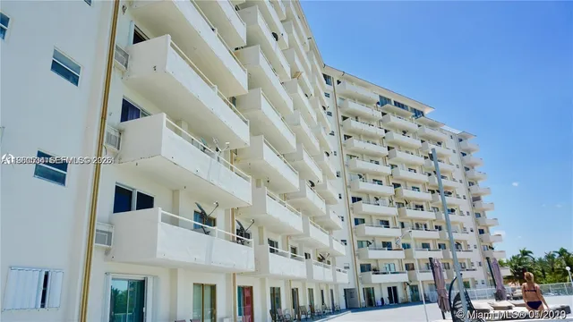 a view of a large building with a street