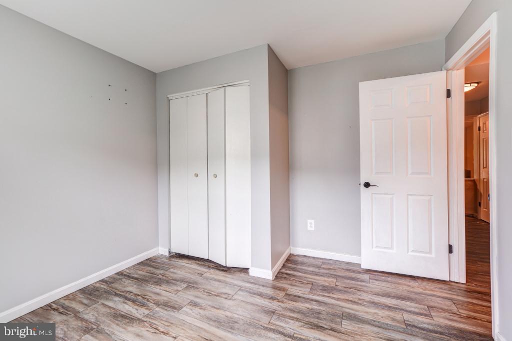 51 Kinsman View Circle Silver Spring, MD 20901 - Photo 18 of 32 a view of an empty room with wooden floor