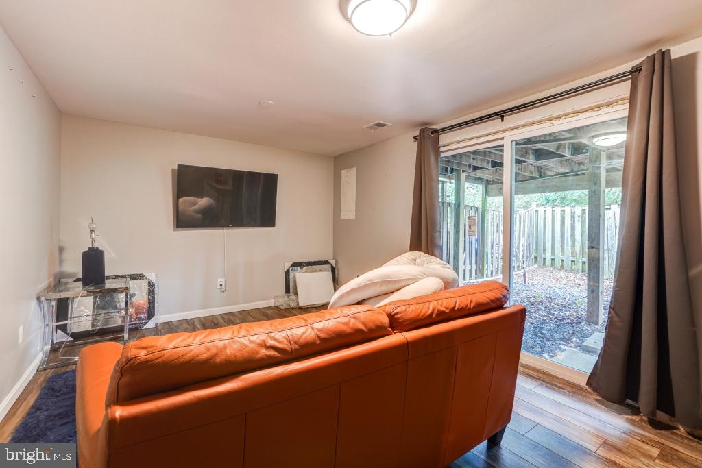 51 Kinsman View Circle Silver Spring, MD 20901 - Photo 19 of 32 a room with furniture and a flat screen tv