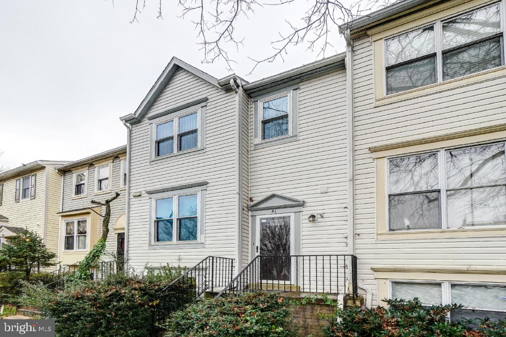 51 Kinsman View Circle Silver Spring, MD 20901 - Photo 2 of 32 a view of a white house next to a yard