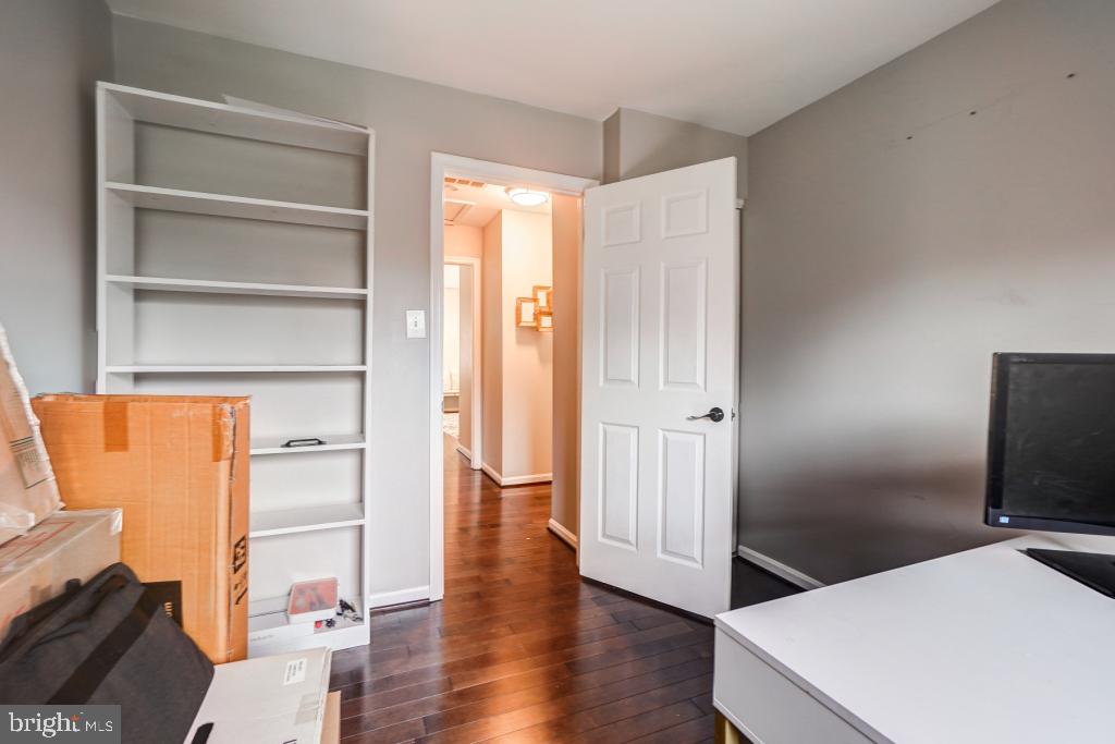 51 Kinsman View Circle Silver Spring, MD 20901 - Photo 24 of 32 a room with a bed and a flat screen tv