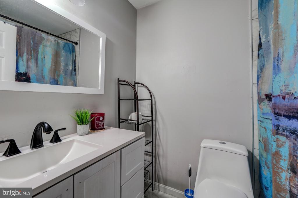 51 Kinsman View Circle Silver Spring, MD 20901 - Photo 26 of 32 a bathroom with a sink toilet and a mirror