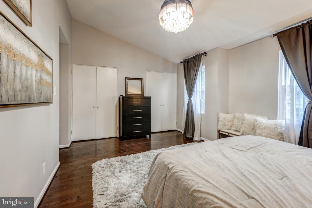51 Kinsman View Circle Silver Spring, MD 20901 - Photo 28 of 32 a bedroom with a bed and wooden floor
