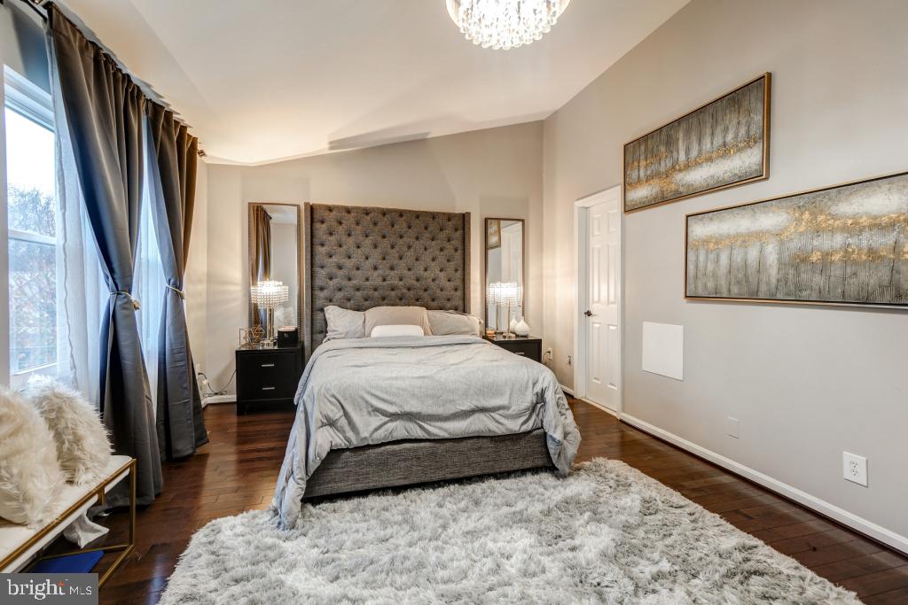 51 Kinsman View Circle Silver Spring, MD 20901 - Photo 30 of 32 a bedroom with a bed rug and wooden floor