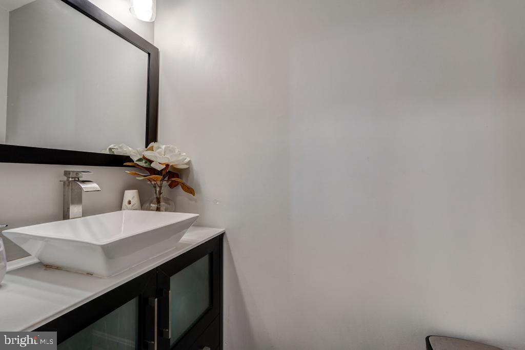 51 Kinsman View Circle Silver Spring, MD 20901 - Photo 3 of 32 a bathroom with a sink and a mirror