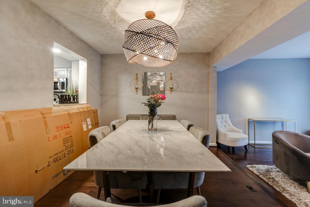 51 Kinsman View Circle Silver Spring, MD 20901 - Photo 10 of 32 a living room with table chairs and a wooden floor