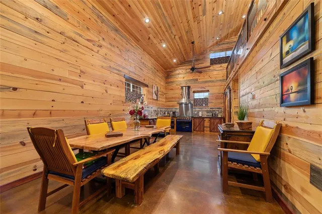 a view of a patio with a table and chairs