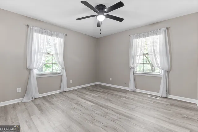 a view of an empty room with a window