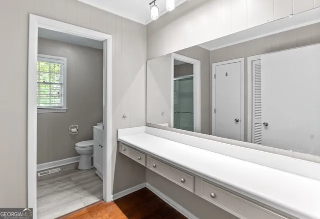 a bathroom with a sink and a large mirror