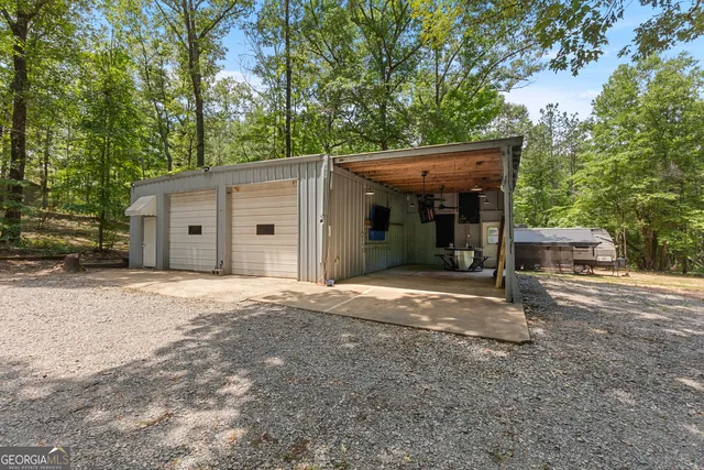 a view of a house with a yard and garage