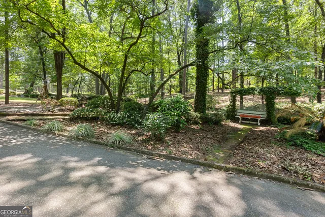a backyard of a house with lots of green space