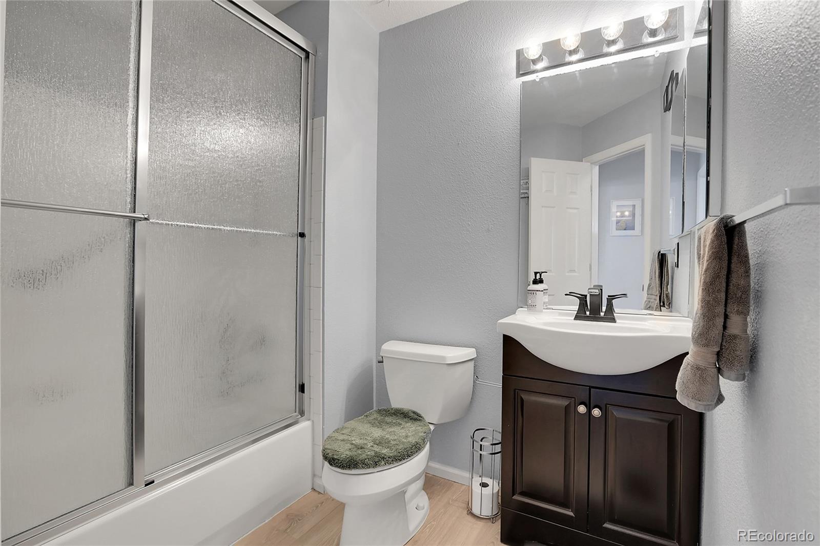 9806 South Castle Ridge Circle Highlands Ranch, CO 80129 - Photo 21 of 36 a bathroom with a sink toilet and shower