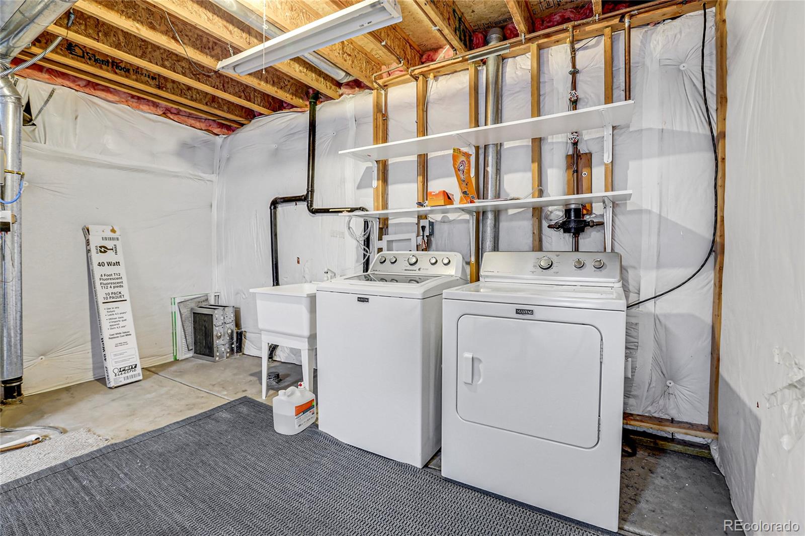9806 South Castle Ridge Circle Highlands Ranch, CO 80129 - Photo 25 of 36 a utility room with dryer and washer