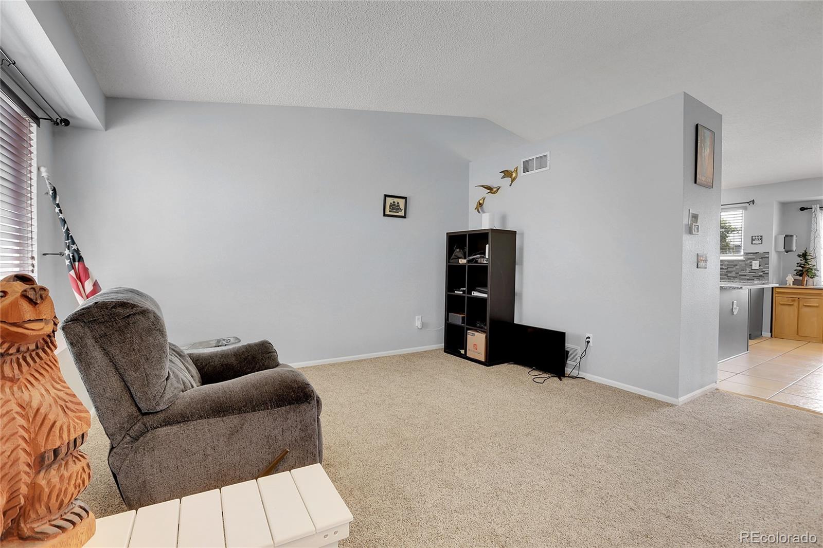 9806 South Castle Ridge Circle Highlands Ranch, CO 80129 - Photo 3 of 36 a living room with furniture