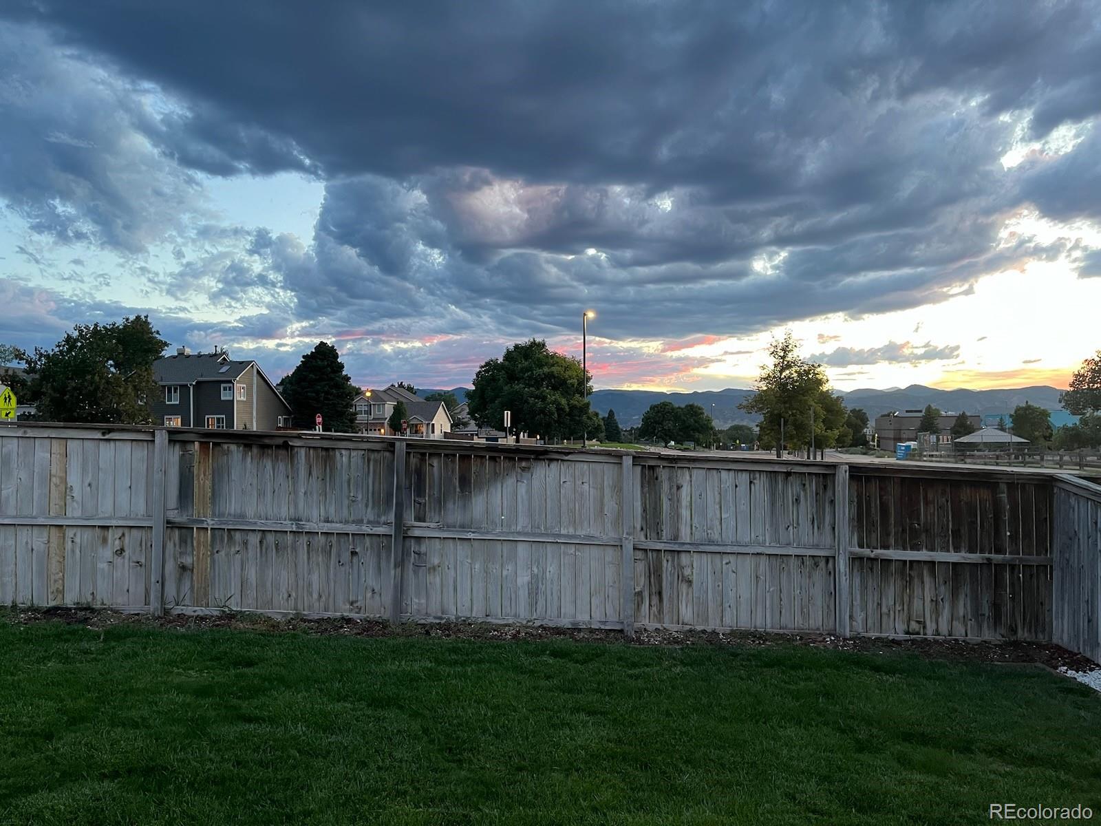 9806 South Castle Ridge Circle Highlands Ranch, CO 80129 - Photo 31 of 36 a view of a backyard with a swing