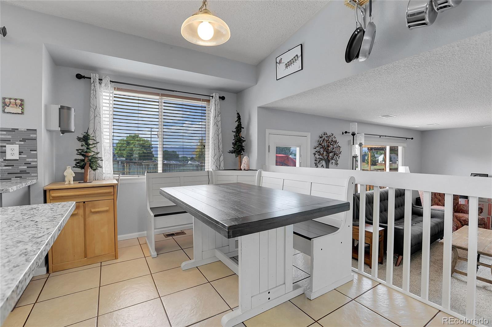 9806 South Castle Ridge Circle Highlands Ranch, CO 80129 - Photo 9 of 36 a kitchen with granite countertop a sink and a stove