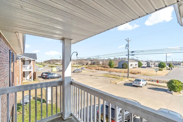 a view of a balcony with city view