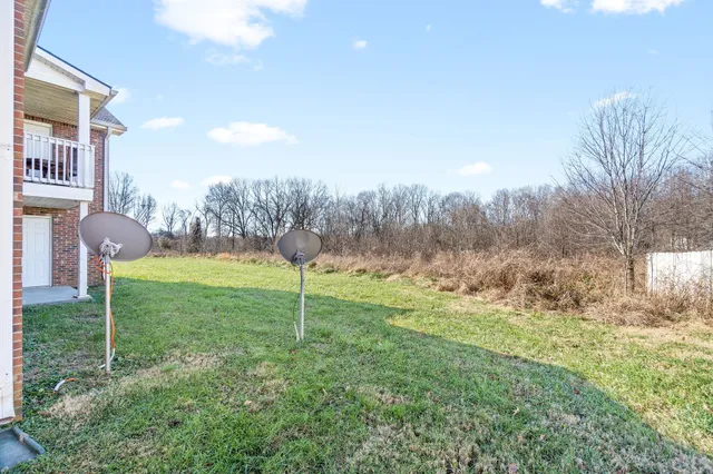 a view of outdoor space with garden and trees