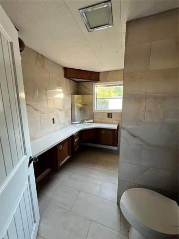 a bathroom with a sink and a shower