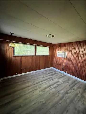 a front view of a house with a garden and yard