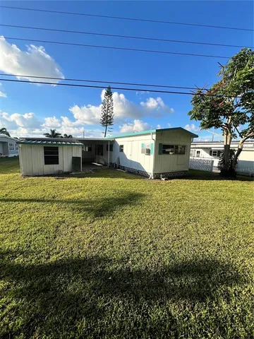 a view of a swimming pool with an outdoor space and seating area