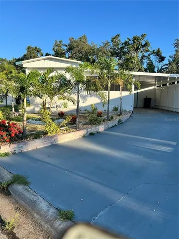 a view of a street with a car parked