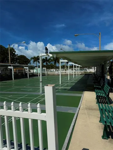 a view of a yard with a wooden fence