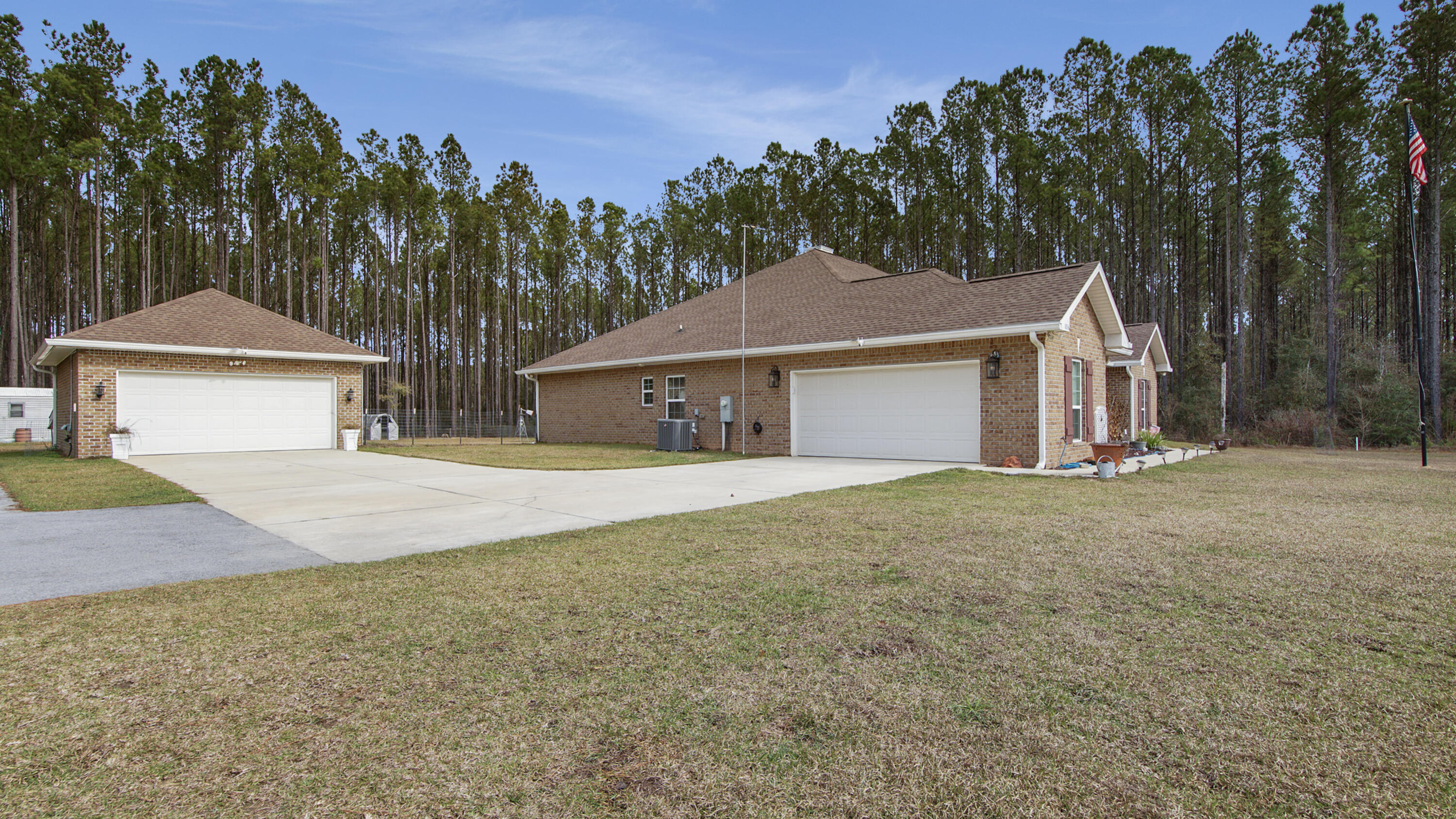 1836 Williams Road DeFuniak Springs, FL 32433 - Photo 11 of 41 a front view of a house with yard and tree s