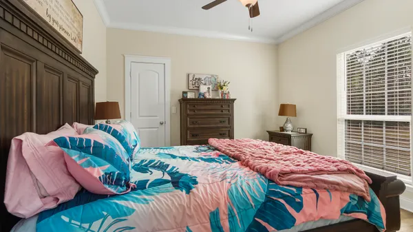 a bedroom with a bed and window