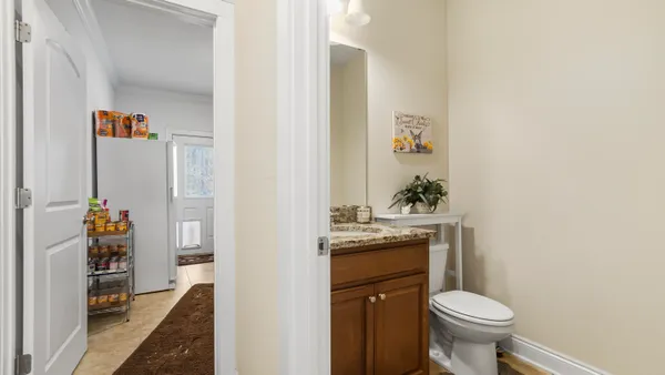 a bathroom with a sink toilet and vanity