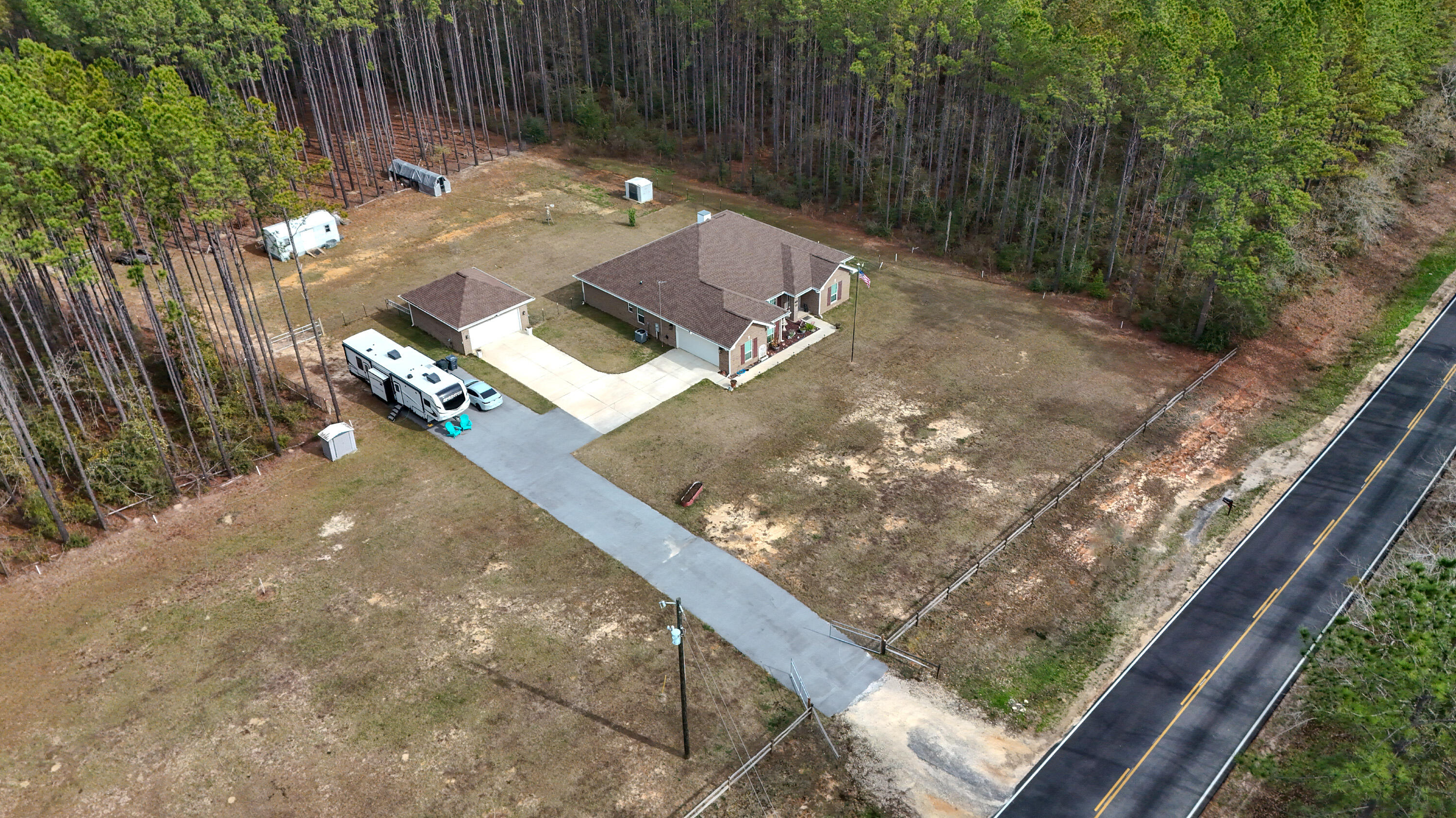 1836 Williams Road DeFuniak Springs, FL 32433 - Photo 2 of 41 a view of a backyard with chairs