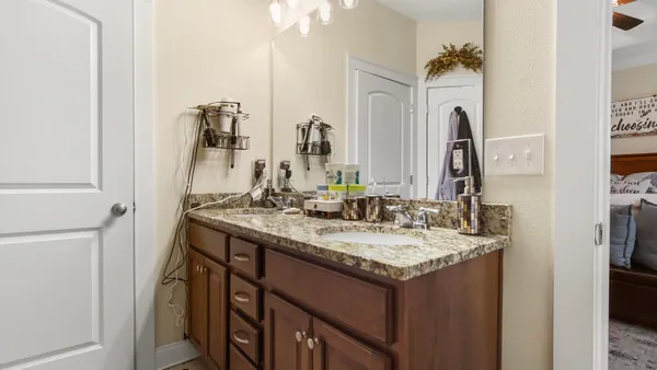 a bathroom with a sink and a mirror