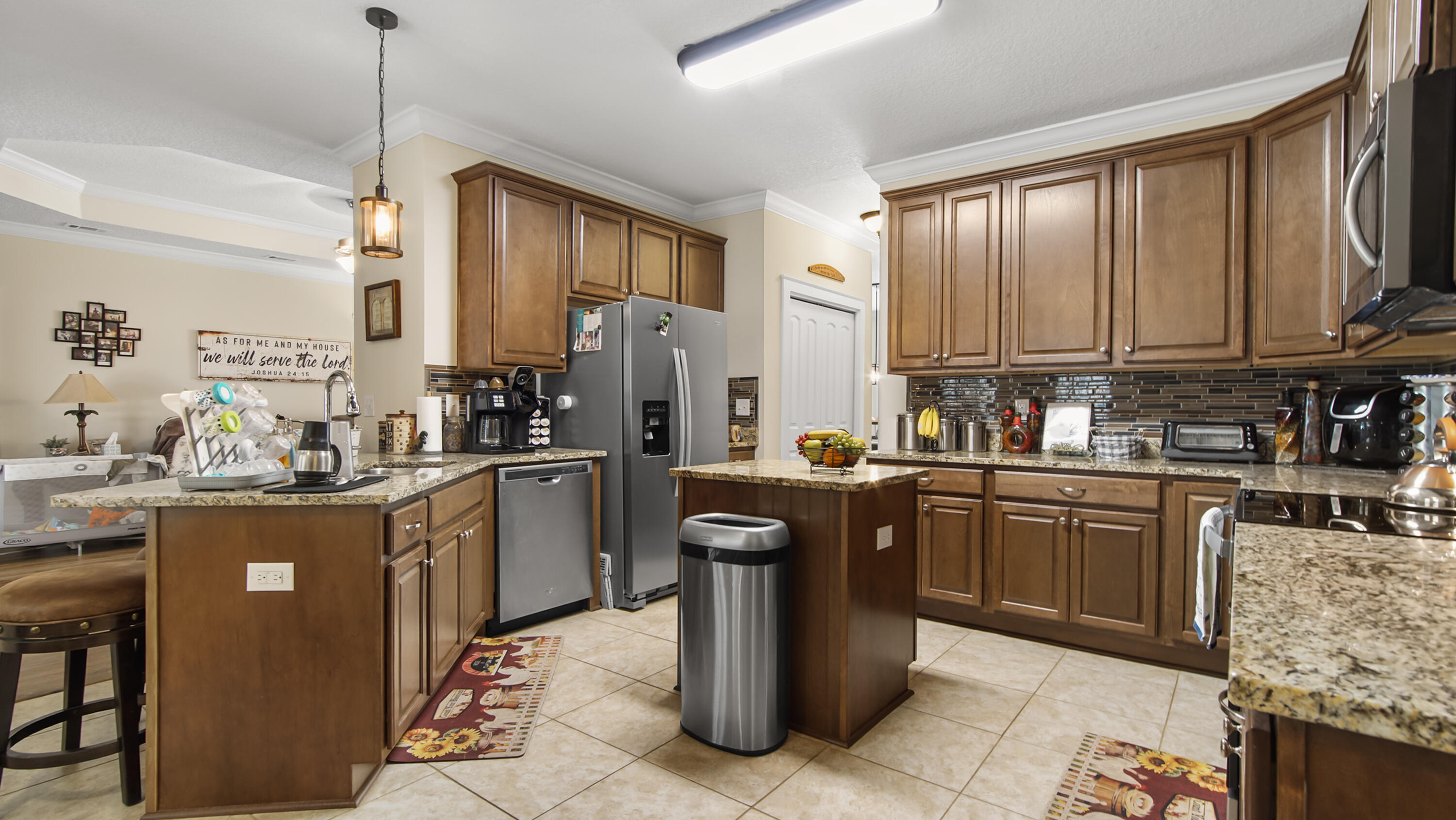 1836 Williams Road DeFuniak Springs, FL 32433 - Photo 32 of 41 a kitchen with a sink refrigerator and cabinets